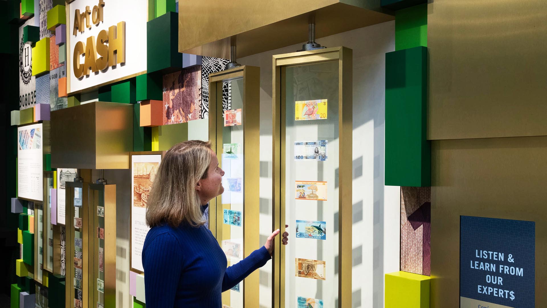 A woman observes a museum exhibit.